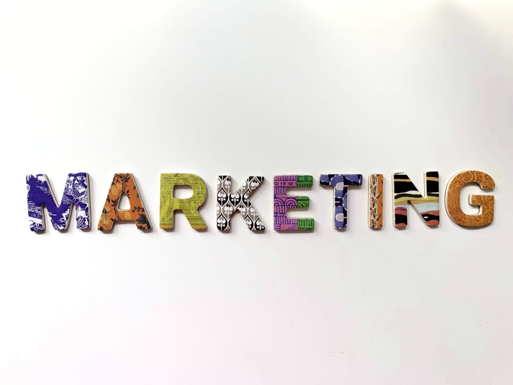 The word "MARKETING" with each letter in a different color